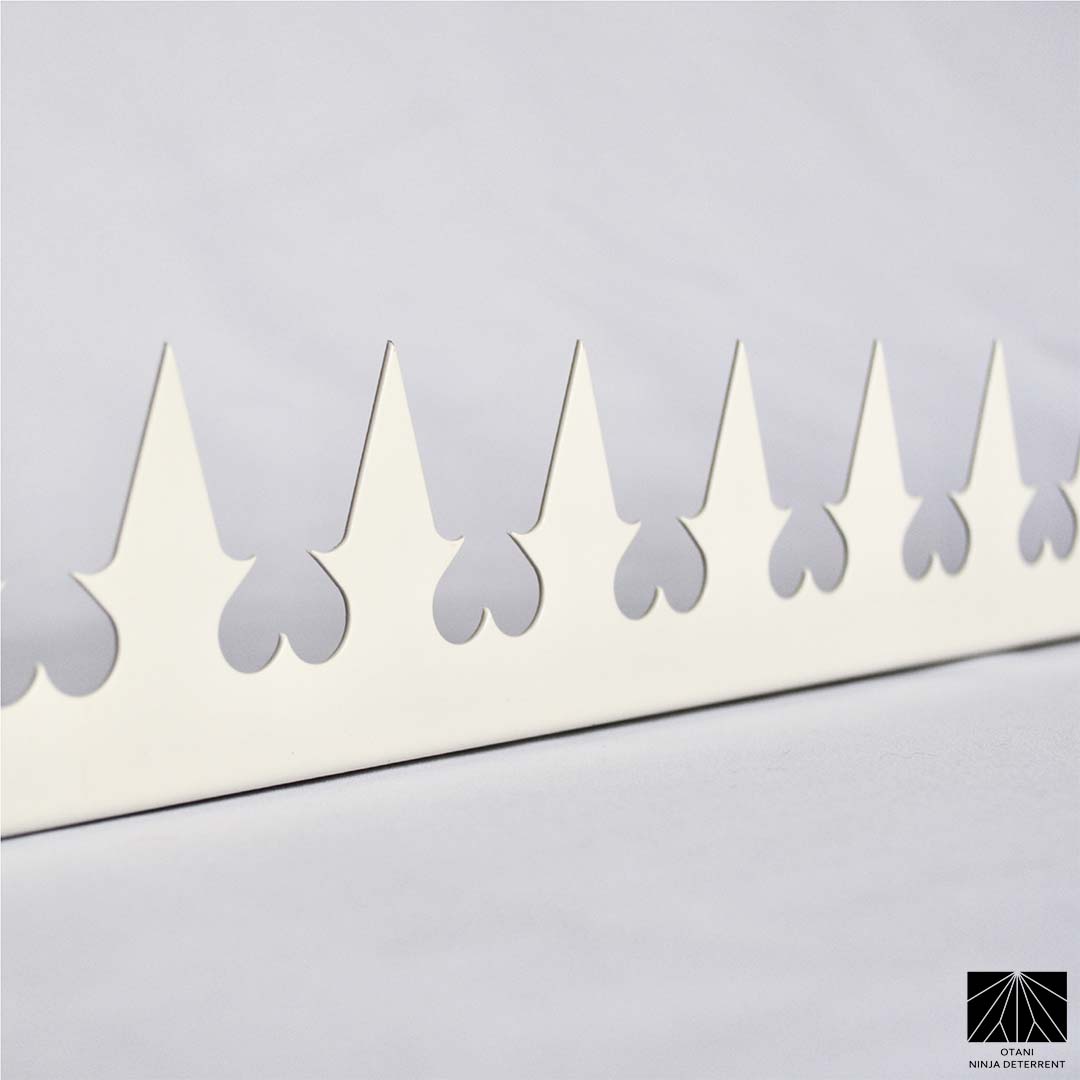 Japanese-made white heart security spike with sharp triangular blades for elegant perimeter and bird deterrence