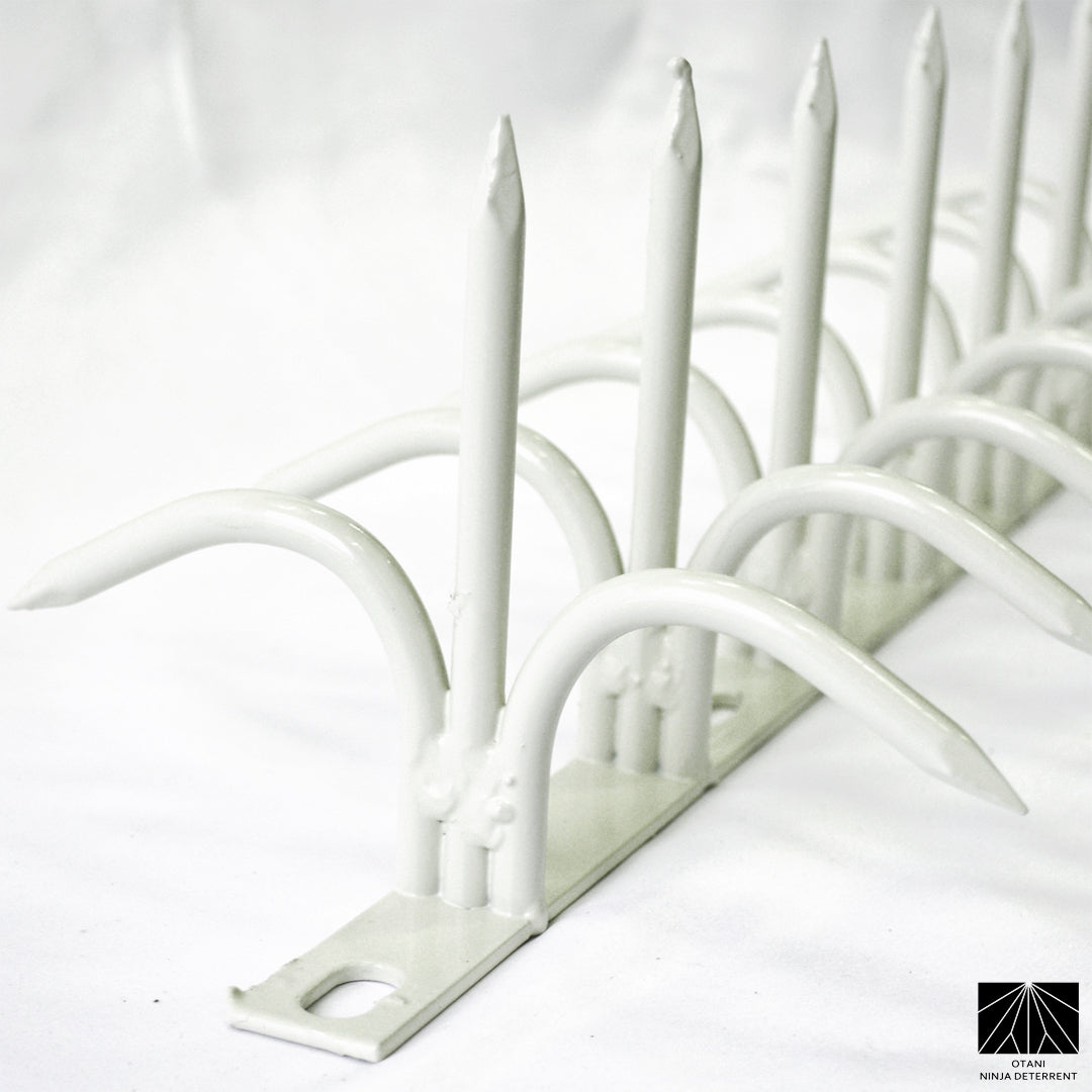 White double-bladed Ninja Deterrent™—refined visual deterrent against pigeons, crows, and trespassers