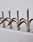 Diagonal close-up view of silver double-bladed Ninja Deterrent™—stylish and sharp anti-bird spike
