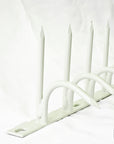 White-coated single-bladed Ninja Deterrent™—blends with light-colored walls for elegant bird repelling design