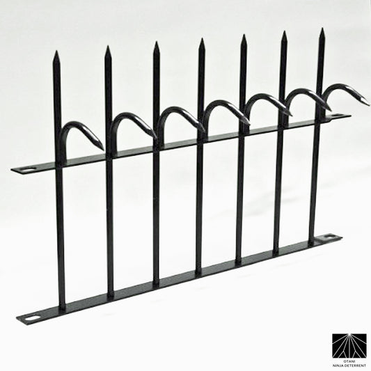 Black powder-coated Ninja Deterrent security spikes for elegant anti-climb protection on fences
