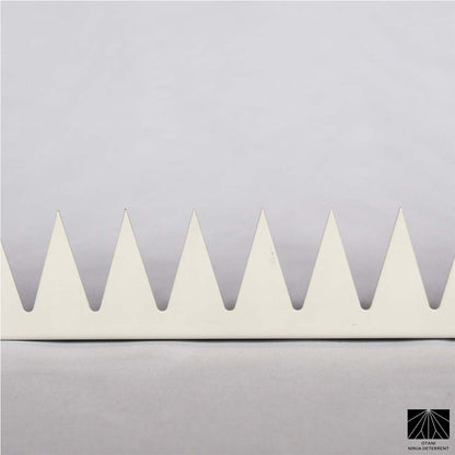 Close-up of precision-cut GIZAGIZA White spike – matte finish, ultra-sharp, and beautifully minimalist

