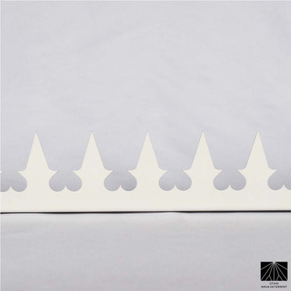 Close-up of precision-cut GIZAGIZA white heart spike – matte finish, ultra-sharp, and beautifully minimalist