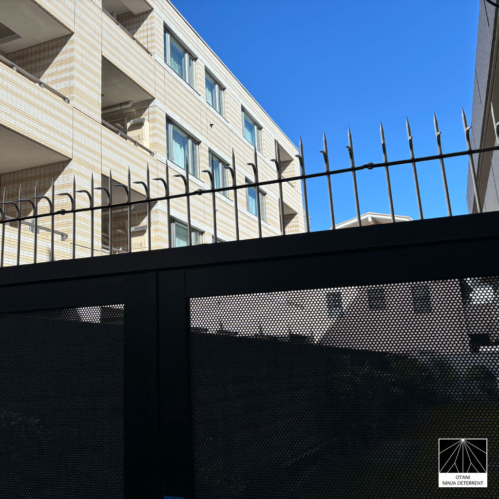 Ninja Deterrent anti-climb and bird control spikes on modern residential fence, offering discreet security protection