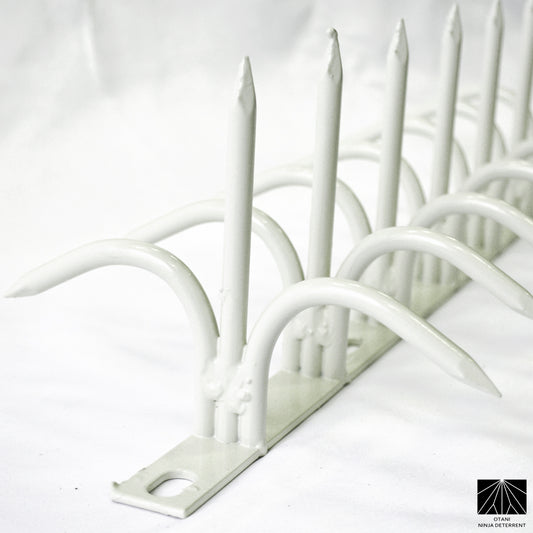White double-bladed Ninja Deterrent™—refined visual deterrent against pigeons, crows, and trespassers
