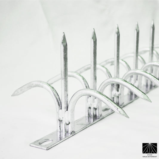 Double-bladed Ninja Deterrent™ in hot-dip galvanized finish—durable anti-rust spike for bird and intruder protection