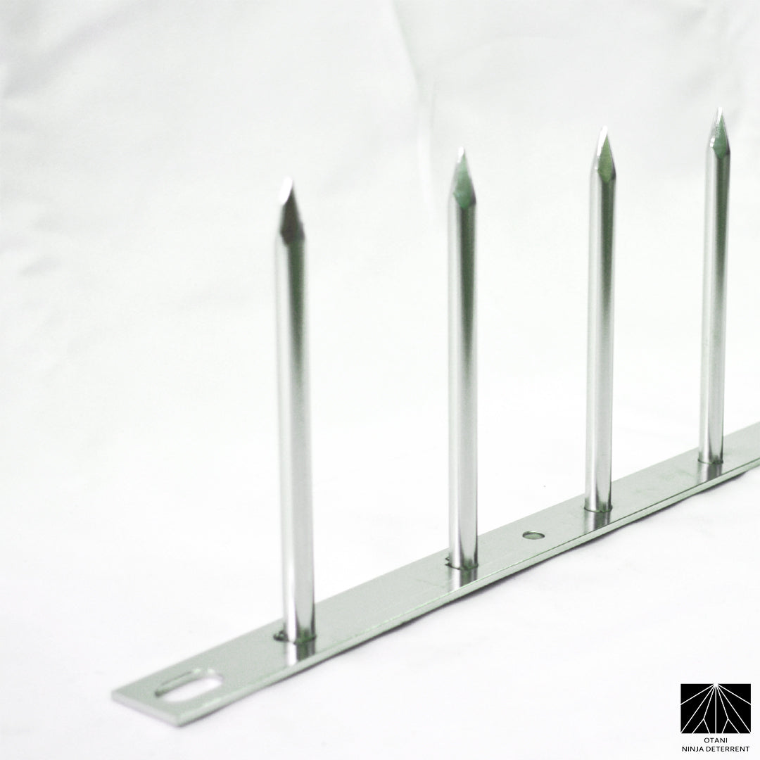 Minimalist None-bladed Ninja Deterrent™ in silver—aesthetic spike system for pigeons and trespassers