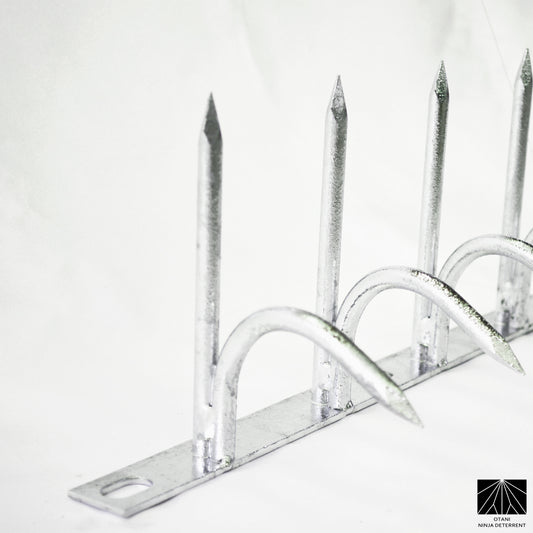 Single-bladed Ninja Deterrent™ in hot-dip galvanized finish—weather-resistant bird and climb deterrent for walls and fences