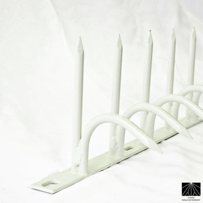 White-coated single-bladed Ninja Deterrent™—blends with light-colored walls for elegant bird repelling design